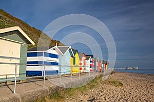 Beach huts along side Cromer beach.