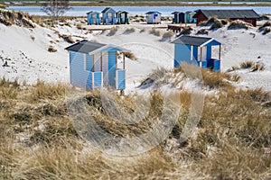 Beach huts or bath cottages on Skanor beach dunes and Falsterbo in South Sweden, Skane travel destination. Domestic tourism