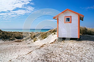 Beach huts or bath cottages on Skanor beach dunes and Falsterbo in South Sweden, Skane travel destination. Domestic tourism