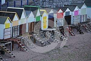 Beach huts in different colours in England.