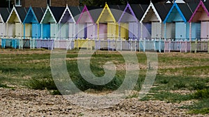 Beach Huts in England after a storm in West Mersea, England UK