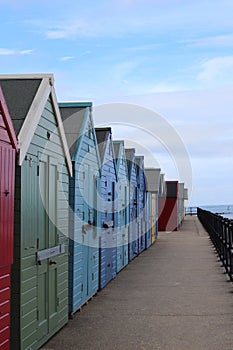 Beach huts in a long colourful row