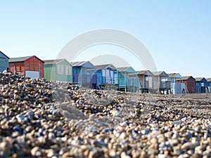Beach Huts on pebble beach photo