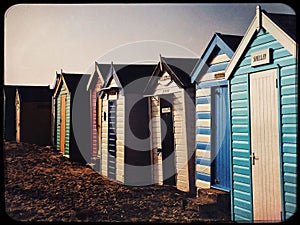 Beach huts on the sand on a cold winter day