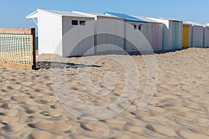 Beach huts on a sandy beach on a sunny day in Blankenberge, Belgium