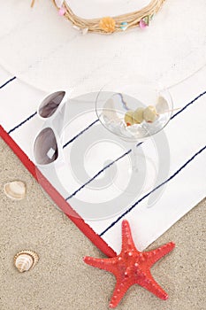 Beach items on sand for fun summer