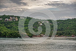 Beach and its resorts on east shore bay, Zihuatanejo, Mexico photo