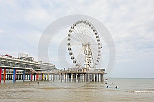 Beach and jetty with ferris wheel of Scheveningen