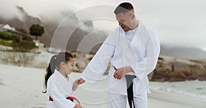 Beach, karate teacher or child learning martial arts, fighting or self defense for wellness or fitness. Man, master or