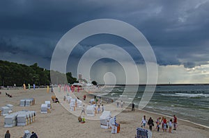 Beach in Kolobrzeg and dramatic heavy clouds in the sky