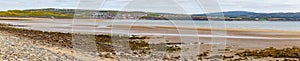 Beach in Lahinch with village in background