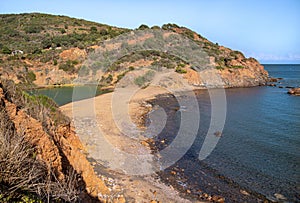 Beach and lake laghetto of terranera,  a natural bay with black sand and free public beach near Porto Azzurro, Island of Elba, I