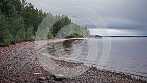 Beach and lakeshore at Lake Siljan in Dalarna, Sweden photo