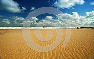 Beach landscape with clouds and sand