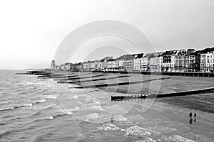 Beach landscape at Hastings with the victorian buildings along the promenade