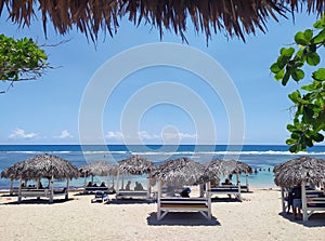 A beach landscape with huts. Un paisaje de playa con chozas photo