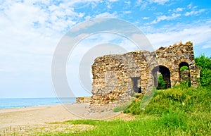 Beach landscape with ruins of castle