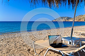 Beach with laptop photo