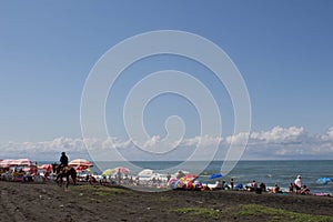 Beach life, holidaymaker at the beach of the image desired blur