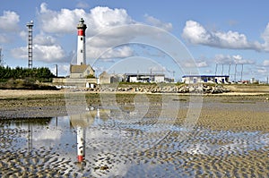 Beach and lighthouse of Ouistreham in France