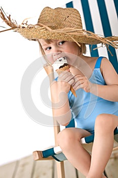Beach - Little girl on deck-chair with ice-cream