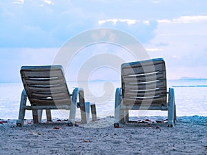 Beach lounge chairs at tropical sea beach background in summer landscape