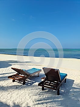 Beach loungers on the dream white beach of the Maldives