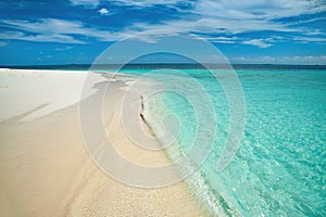 Beach in Maldives with golden sand and turquoise sea photo