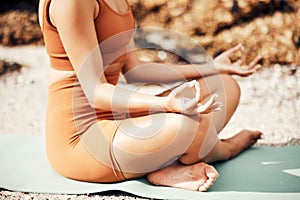 Beach meditation yoga, peace and woman meditate for chakra energy healing of soul, aura or spiritual balance. Zen