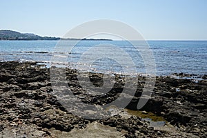 Beach on the Mediterranean coast in Pefkos or Pefki, Rhodes island, Greece