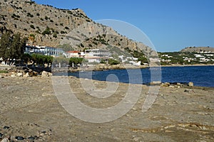 Beach on the Mediterranean coast in Pefkos or Pefki, Rhodes island, Greece