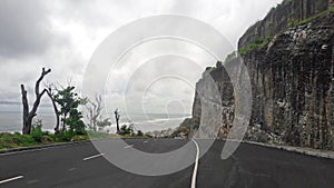 the beach melasti bali with conditions that are rather cloudy and quiet