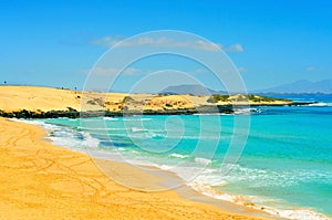 Beach in Natural Park of Dunes of Corralejo in Fuerteventura photo