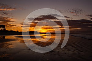 beach in nelson during a breathtaking sunset on Tahunanui Beach at Nelson, New Zealand