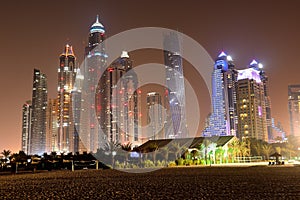 Beach in night illumination at the luxury hotel