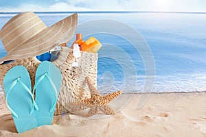 Beach objects on sand, space for text. Summer vacation