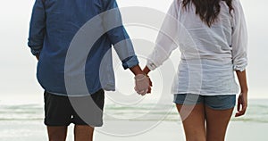 Beach, ocean and couple holding hands, walking and bonding with tropical journey, freedom and outdoor trip. Nature view