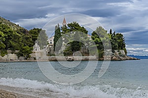 Beach at old Dominican monastery and Zlatni rat in background, Bol, Island of Brac, Croatia