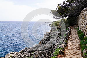 Beach paca paved pathway of mediterranean sea in south Antibes Juan-les-Pins France southeast