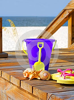 Beach pail on boardwalk