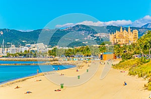 Beach at Palma de Mallorca with the cathedral at background, Spain