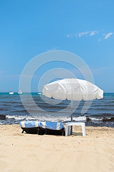 Beach with parasols and beds