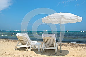 Beach with parasols and beds