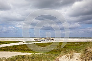 Beach pavilion on the beach of Schiermonnikoog on the North Sea seen from the dunes