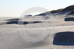 Beach pavilion and sand patterns, dutch Ameland Island photo