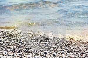 Beach pebble stones sea shore. Summer vacation background.