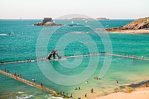 Beach , people and sea open swimming pool in Saint Malo, France