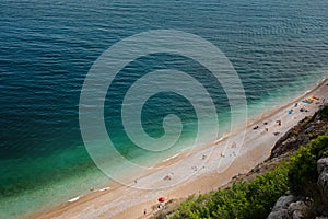 Beach people swim, sunbathe top view. Tropical beach azure sea, ocean. Copy space