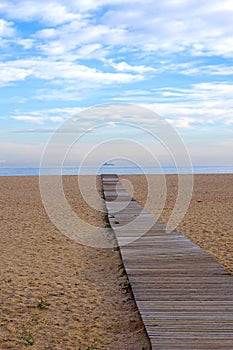 Wooden pathway to the sea in Arenys de Mar photo