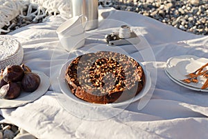 Beach picnic with cake and figs